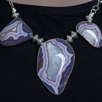 Sterling silver necklace with 3 purple passion stones